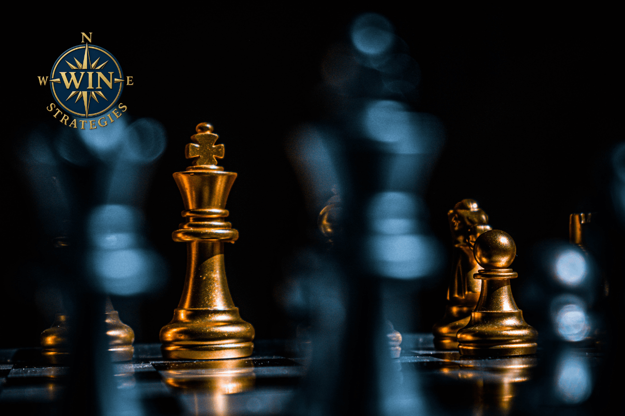 Gold Chess Pieces on Black Surface